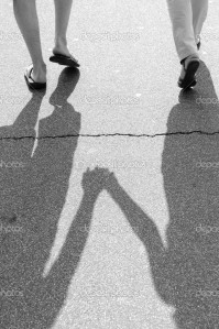 depositphotos_29917179-Black-and-white-photo-of-shadow-of-a-couple-walking-on-a-street
